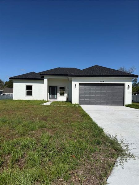Front exterior of a new home in , Ocala, FL, highlighting curb appeal (Image 17).