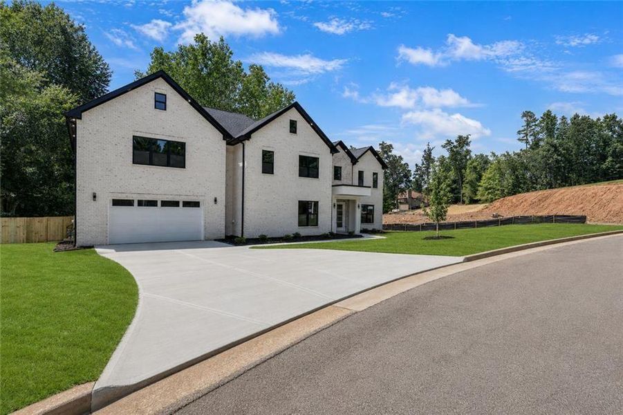 Front exterior of a new home in , Snellville, GA, highlighting curb appeal (Image 30). Front exterior of a new home in , Snellville, GA, highlighting curb appeal (Image 30).