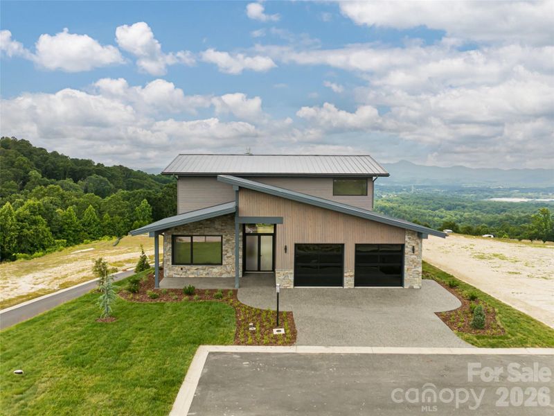 Front exterior of a new home in , Hendersonville, NC, highlighting curb appeal (Image 26).