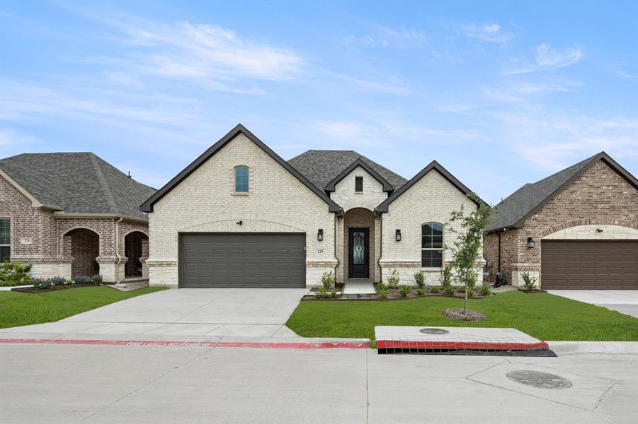 Front exterior of a new home in Ladera at Timberbrook, Justin, TX, highlighting curb appeal (Image 22). Front exterior of a new home in Ladera at Timberbrook, Justin, TX, highlighting curb appeal (Image 22).