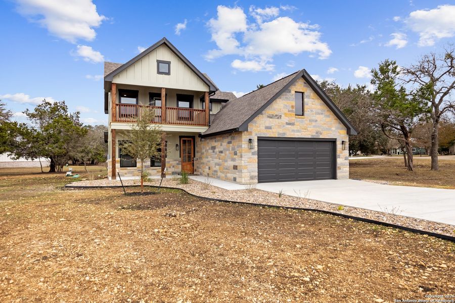 Front exterior of a new home in , Bandera, TX, highlighting curb appeal (Image 23).