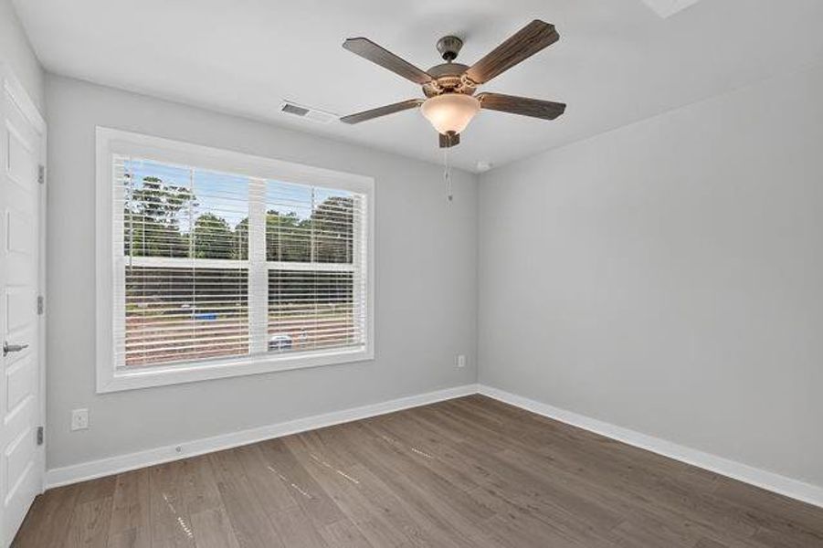 Spacious, unfurnished interior of a new home in The Cottages at East Lanier, Fayetteville (Image 23).
