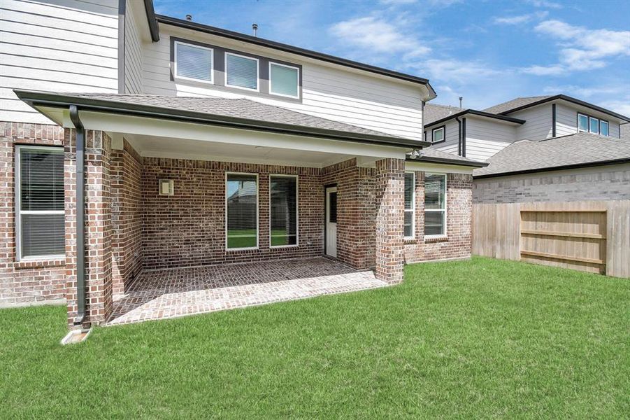 Experience outdoor living at its finest on this expansive covered patio, thoughtfully designed for BBQs and delightful al fresco dining.