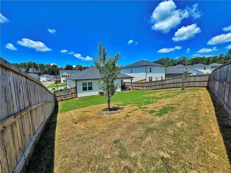Exterior details and patio area of a home in Oakchase at Hampton, Hampton (Image 29).