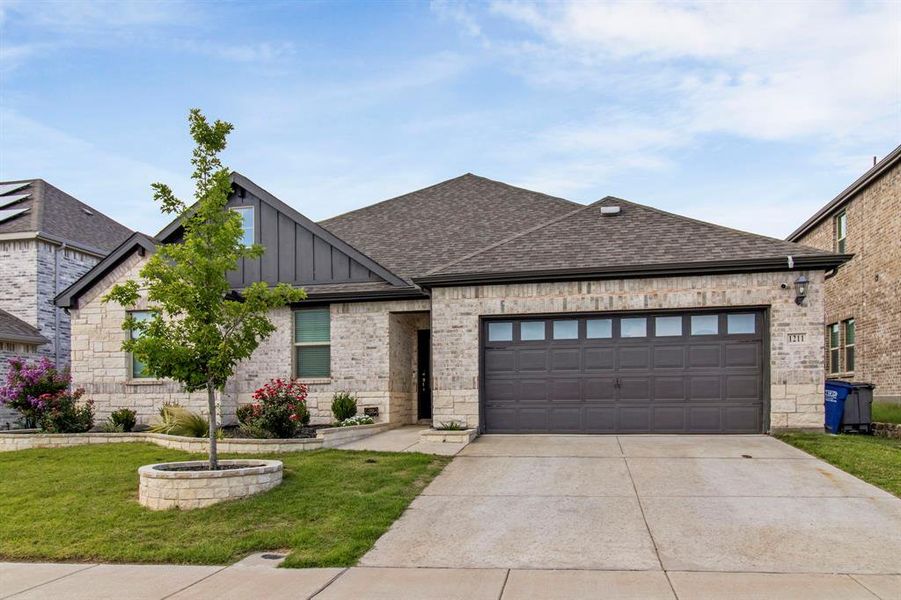 Front exterior of a new home in Wolf Creek Farms - Premier Series, Melissa, TX, highlighting curb appeal (Image 22). Front exterior of a new home in Wolf Creek Farms - Premier Series, Melissa, TX, highlighting curb appeal (Image 22).