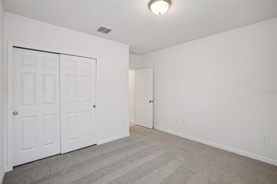 Spacious, unfurnished interior of a new home in Villamar - Signature Series, Winter Haven (Image 23).