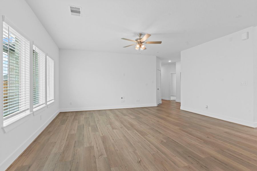 Another angle of the open living area showcasing the flexible layout, large windows that fill the space with natural light, and generous wall space—perfect for customizing your ideal setup. **Image Representative of Plan Only and May Vary as Built**.