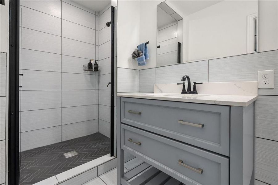 Bathroom with a stall shower and vanity Bathroom with a stall shower and vanity