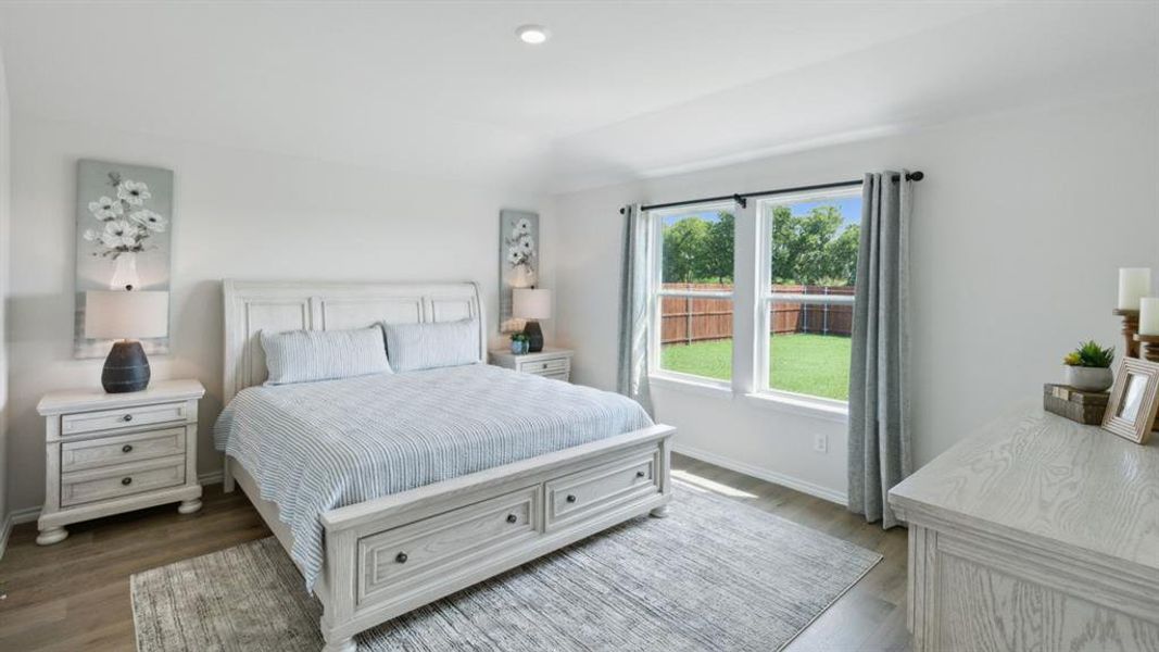 Bedroom with light wood-type flooring and recessed lighting