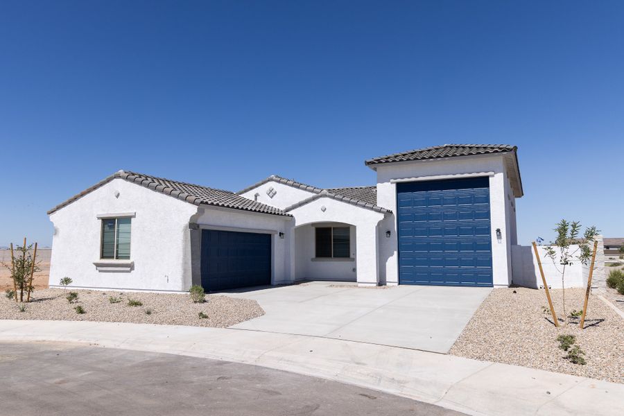 Front exterior of a new home in Rancho Mirage, Maricopa, AZ, highlighting curb appeal (Image 2). Front exterior of a new home in Rancho Mirage, Maricopa, AZ, highlighting curb appeal (Image 2).