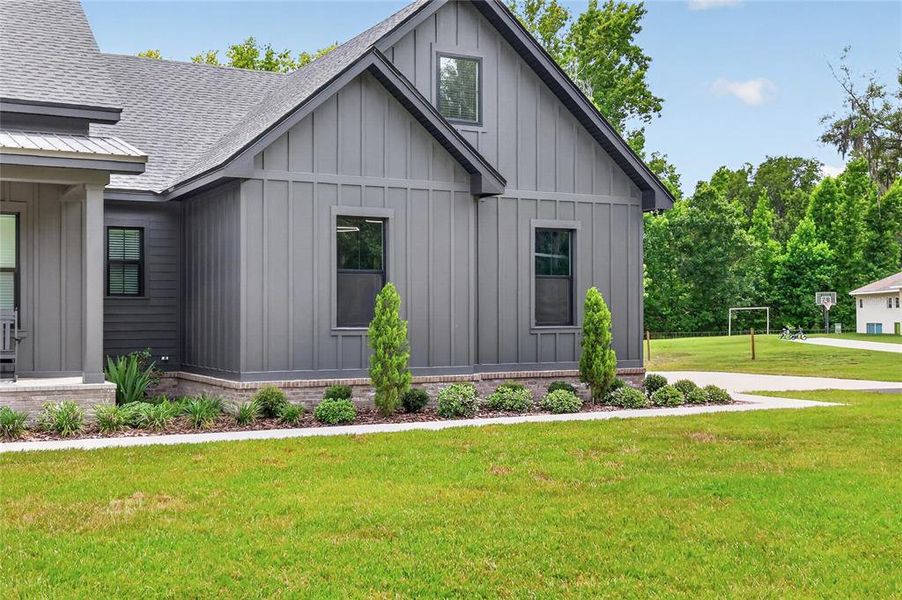 Front exterior of a new home in , Lakeland, FL, highlighting curb appeal (Image 27).