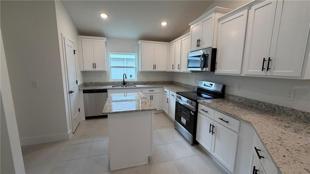 Furnished interior view inside a new home in Watercress Cove, North Port (Image 5).