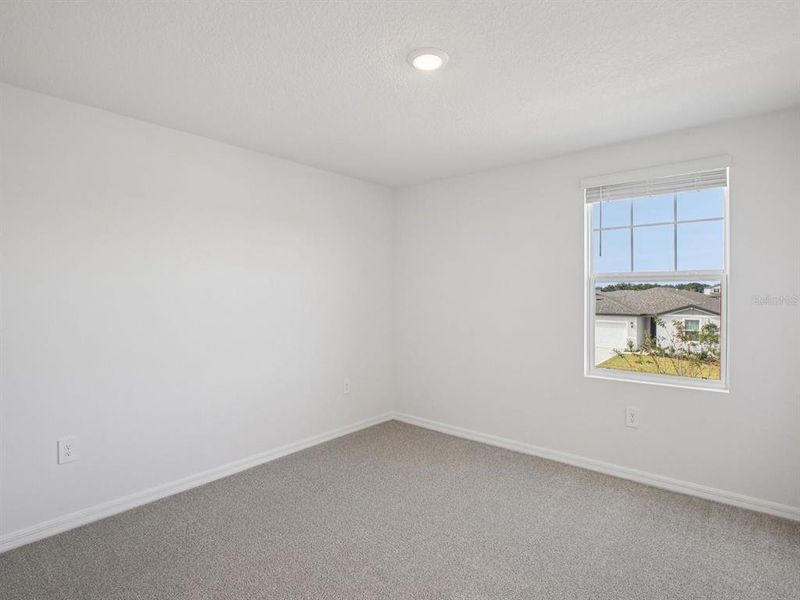 Spacious, unfurnished interior of a new home in The Grove at Stuart Crossing - Classic Series, Bartow (Image 38).