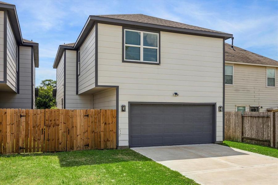 rear loading oversized 2 car garage. Long driveway for extra parking.