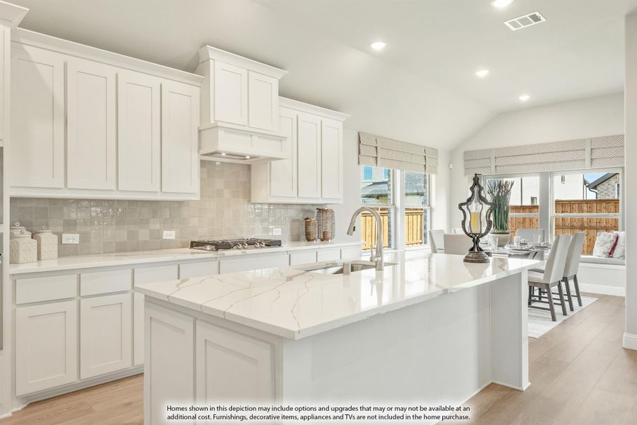 Kitchen with white cabinets, large island with marble countertops, tile backsplash, and open dining area beyond. Kitchen with white cabinets, large island with marble countertops, tile backsplash, and open dining area beyond.