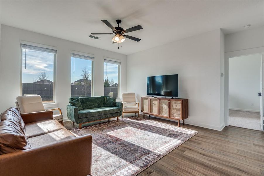 Furnished interior view inside a new home in Prairie Ridge at Goodland, Venus (Image 8).