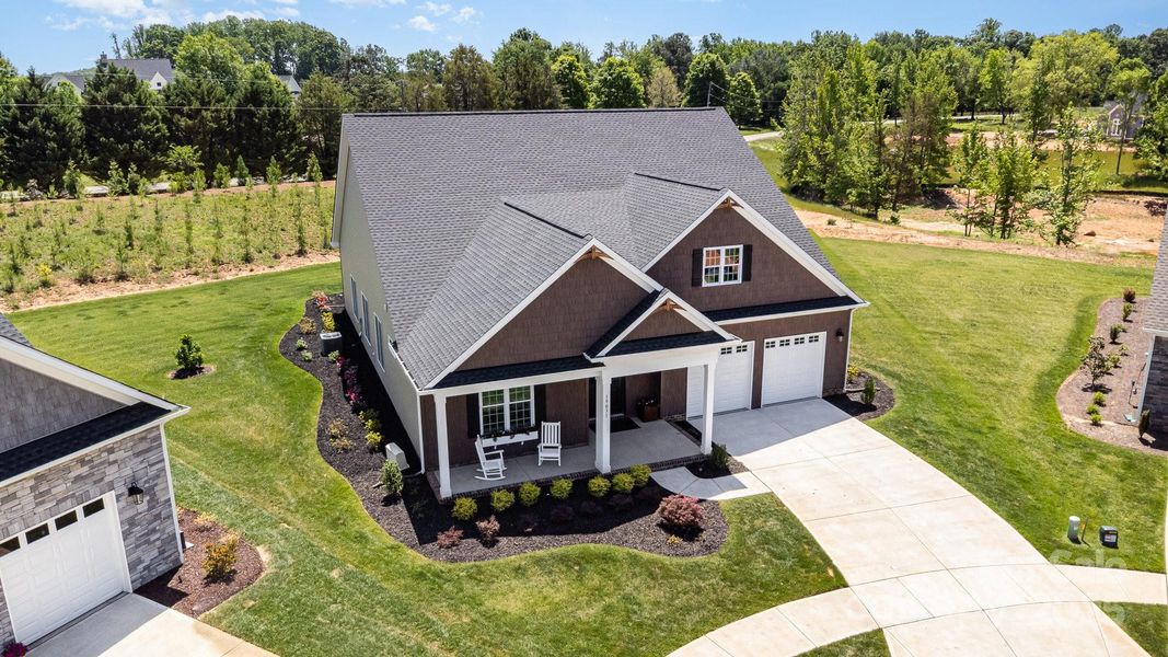 The setting is lovely with so much green surrounding the home. The setting is lovely with so much green surrounding the home.