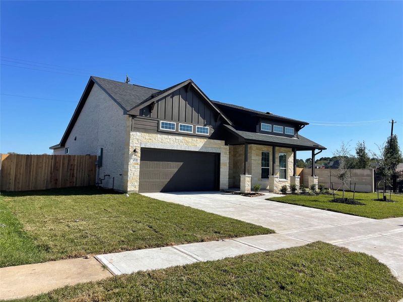 Front exterior of a new home in Martha's Vineyard, Alvin, TX, highlighting curb appeal (Image 2). Front exterior of a new home in Martha's Vineyard, Alvin, TX, highlighting curb appeal (Image 2).