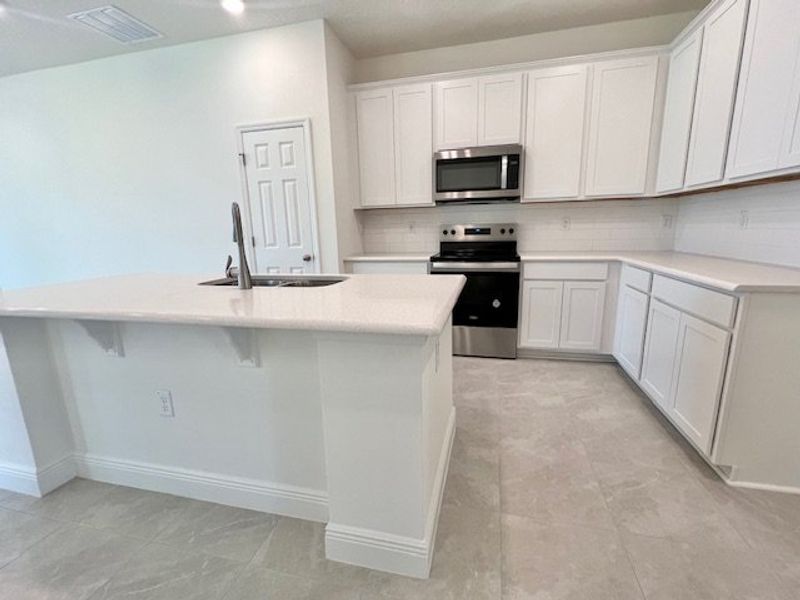 Furnished interior view inside a new home in Lakes At St Sebastian, Micco (Image 8).