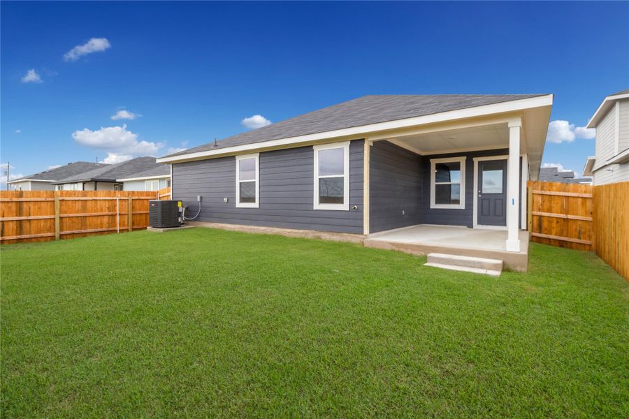 Exterior details and patio area of a home in Monarch Ranch, Manor (Image 1).