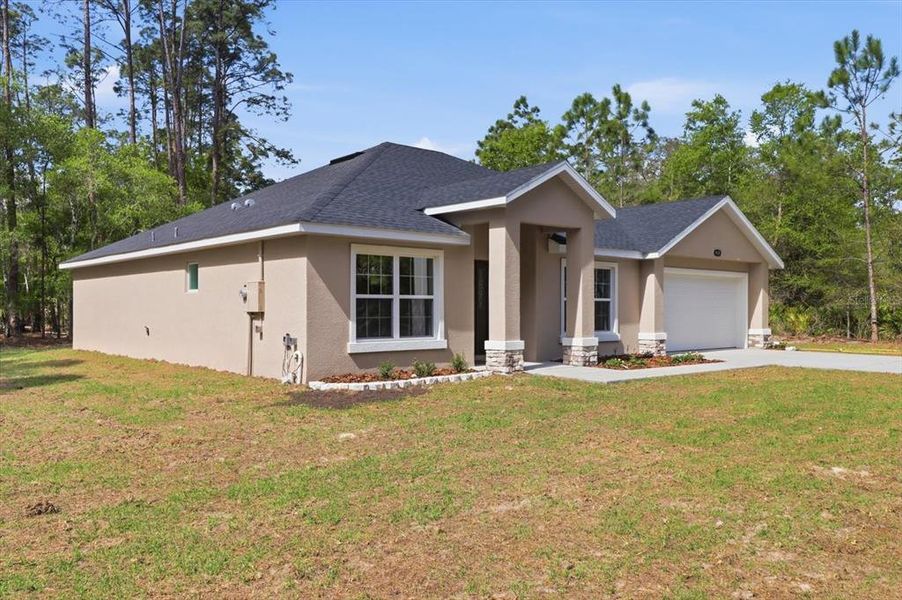 Front exterior of a new home in , Crystal River, FL, highlighting curb appeal (Image 30).