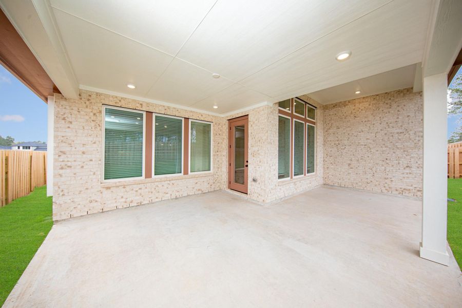 Step outside to the covered rear patio, the perfect extension of your indoor living space for year-round enjoyment. Step outside to the covered rear patio, the perfect extension of your indoor living space for year-round enjoyment.