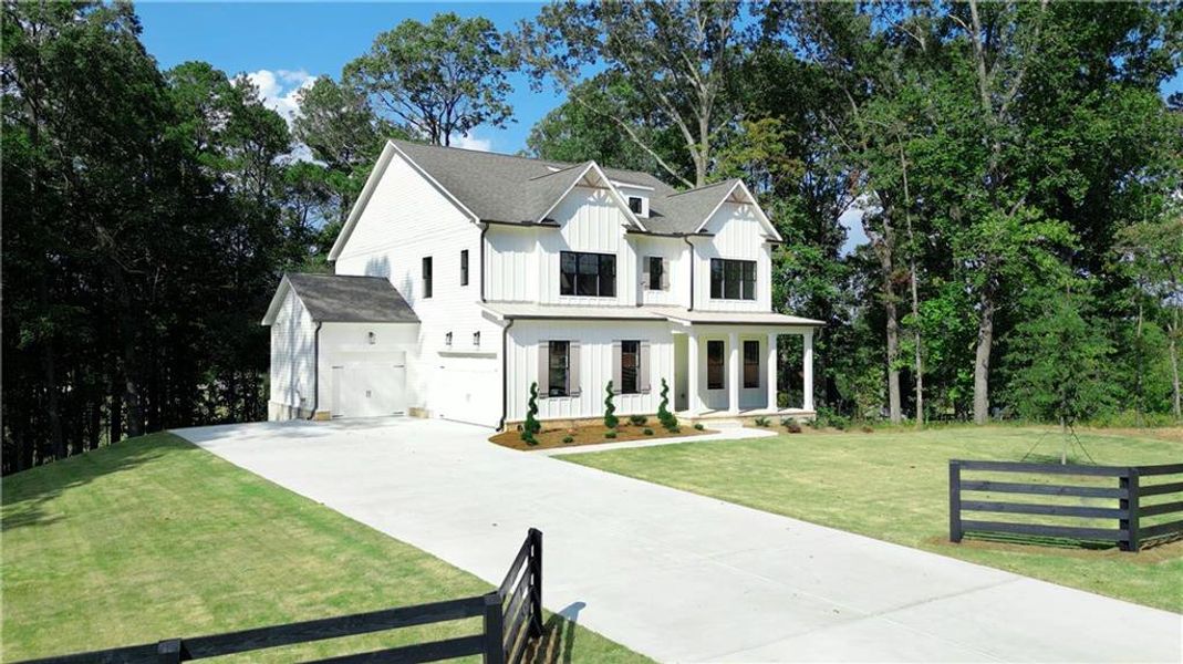 Front exterior of a new home in , Canton, GA, highlighting curb appeal (Image 2).