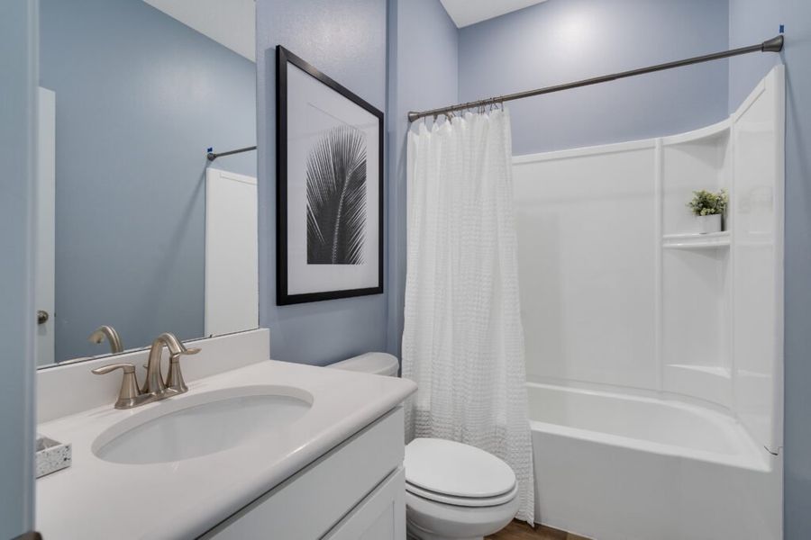 Representative furnished interior of a home built from the Biscayne by Holiday Builders in Pineapple Grove, Port St. Lucie (Image 11).