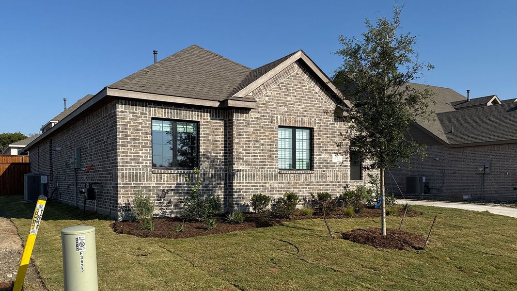 Front exterior of a new home in Peachtree Meadows, Rockwall, TX, highlighting curb appeal (Image 15).