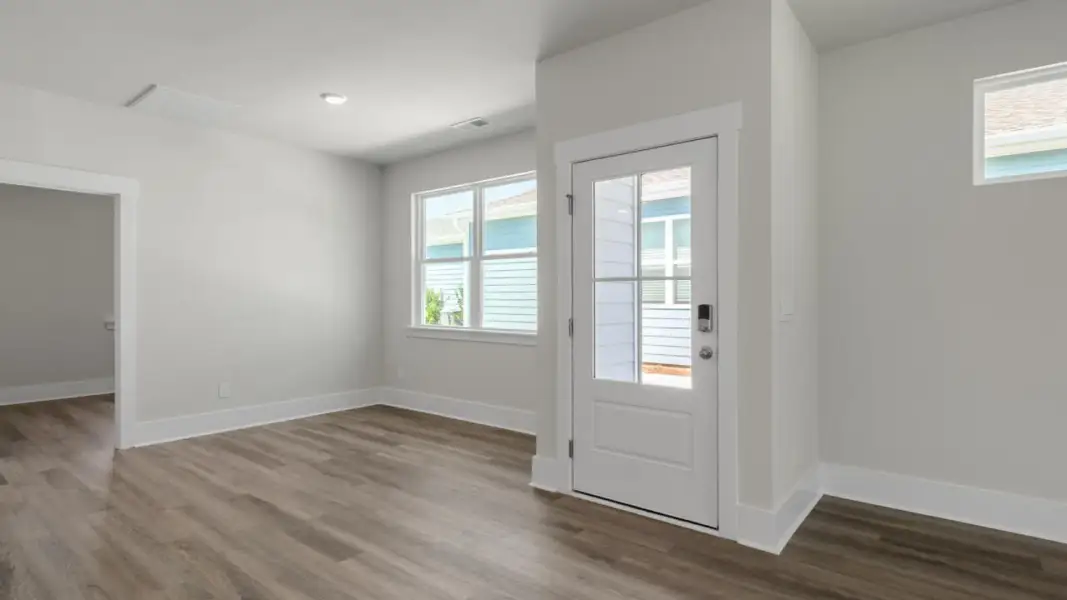 Spacious, unfurnished interior of a new home in The Retreat at Indigo Preserve Townhomes, Leland (Image 11).