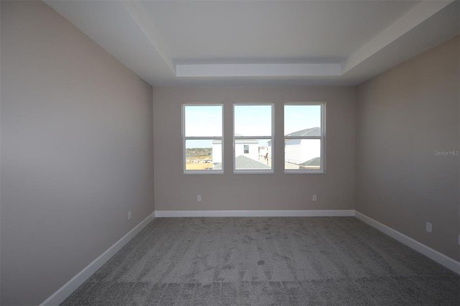 Spacious, unfurnished interior of a new home in Lake Star at Ovation, Winter Garden (Image 17).