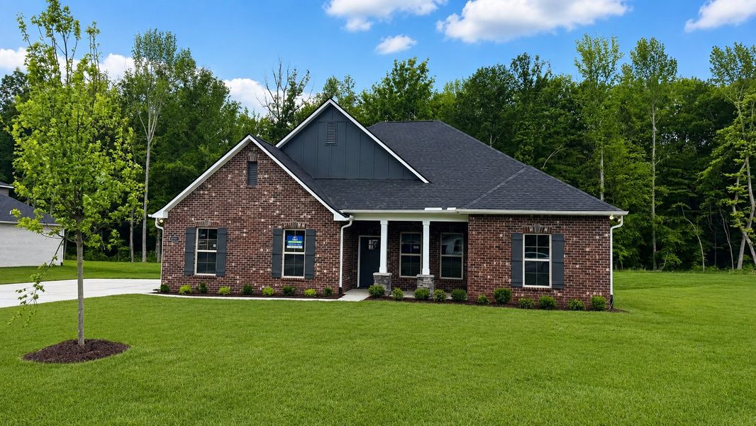 Front exterior of a new home in The Estates at Highland Reserves, Pleasant View, TN, highlighting curb appeal (Image 2). Front exterior of a new home in The Estates at Highland Reserves, Pleasant View, TN, highlighting curb appeal (Image 2).