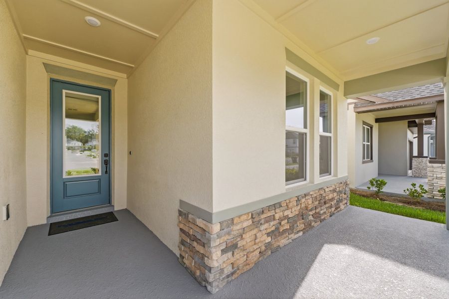 Exterior details and patio area of a home in Oakfield at Mount Dora Village Series, Mount Dora (Image 29).