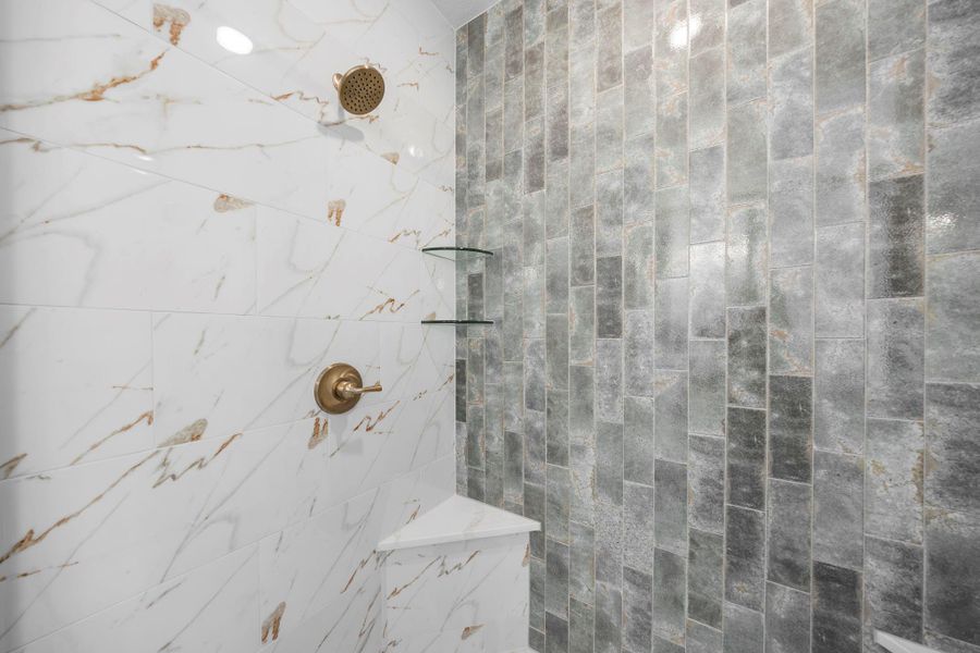 Bathroom featuring tiled shower