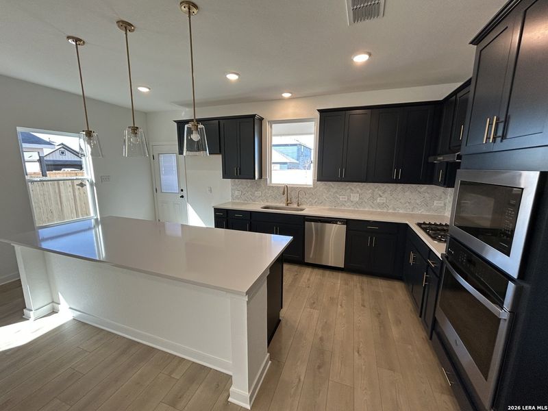 Furnished interior view inside a new home in Hennersby Hollow, San Antonio (Image 7).