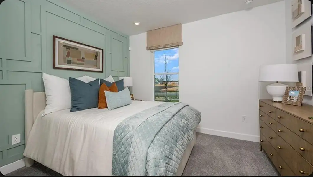 Furnished interior view inside a new home in Esplanade at McKinnon Groves, Winter Garden (Image 8).