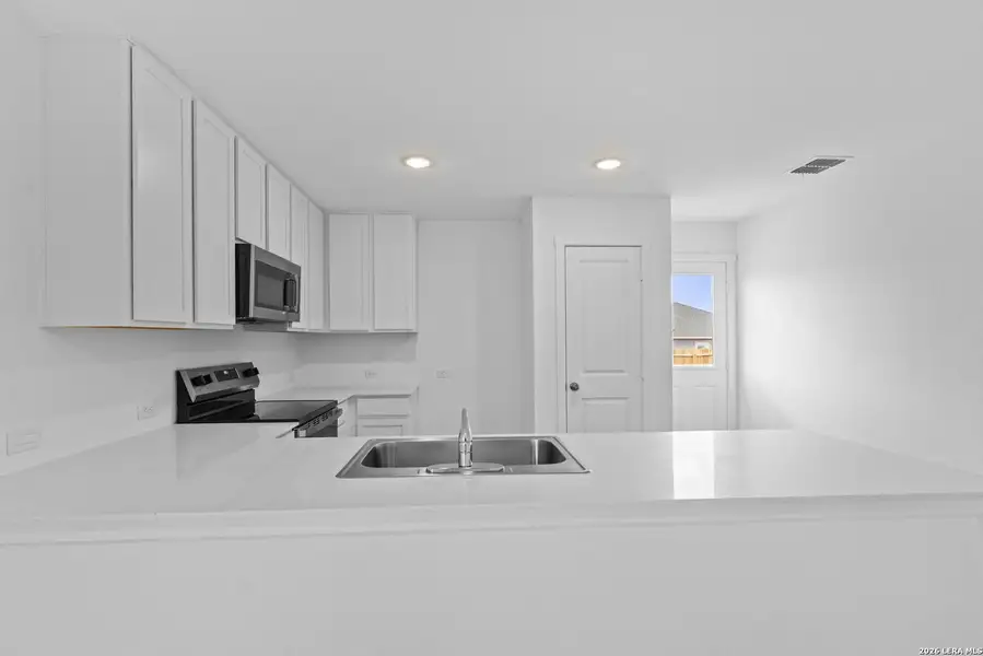Furnished interior view inside a new home in Hidden Oasis, San Antonio (Image 7).