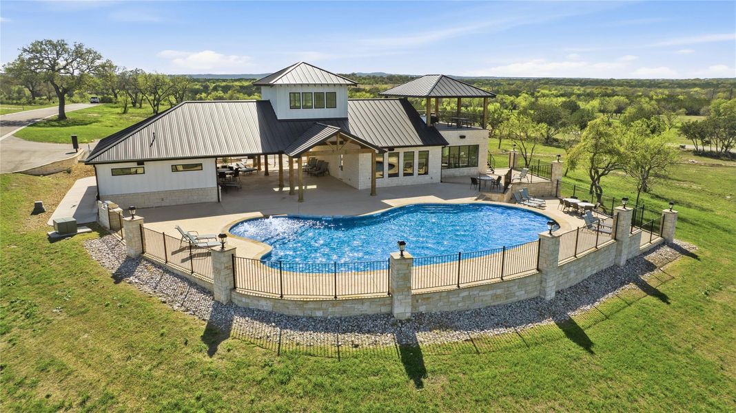 An inviting in-ground pool offers relaxation and recreation with scenic views.