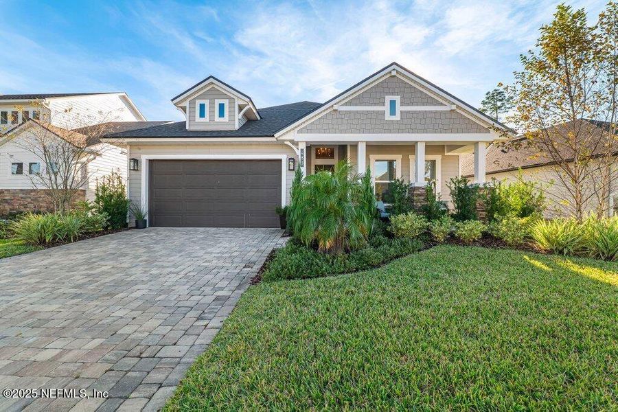 Front exterior of a new home in Courtney Chase, St. Augustine, FL, highlighting curb appeal (Image 1).