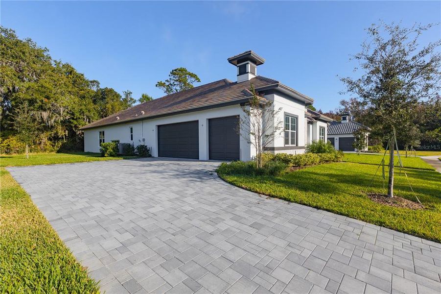 Front exterior of a new home in Toscana, Palm Coast, FL, highlighting curb appeal (Image 21).