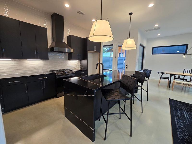 Matching black stainless steel Samsung appliances.