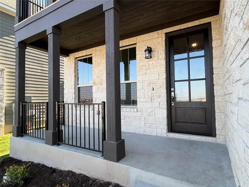 Exterior details and patio area of a home in Lariat, Liberty Hill (Image 3).