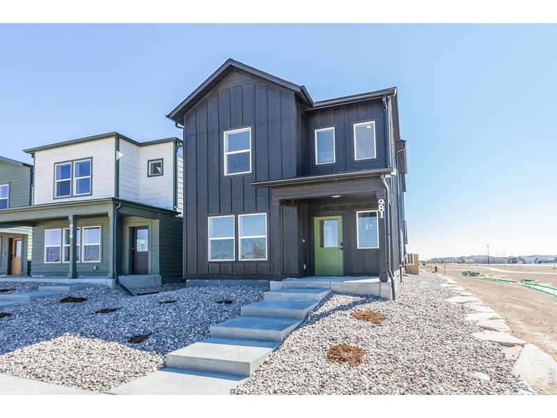 Front exterior of a new home in Prairie Song Story Collection - Single Family Homes, Windsor, CO, highlighting curb appeal (Image 24).