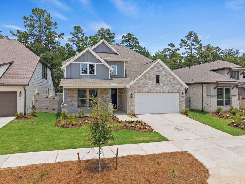 Front exterior of a new home in Two Step Farm, Montgomery, TX, highlighting curb appeal (Image 1). Front exterior of a new home in Two Step Farm, Montgomery, TX, highlighting curb appeal (Image 1).