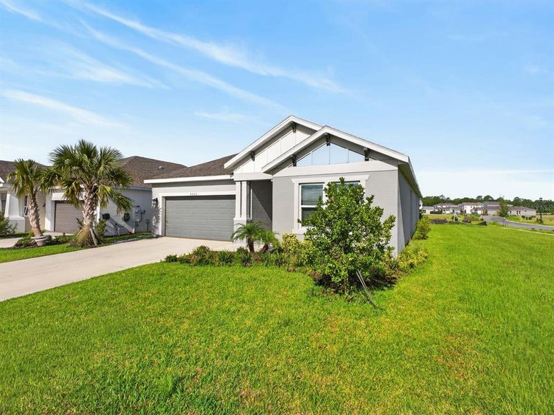 Front exterior of a new home in Westview Community Group Page, Kissimmee, FL, highlighting curb appeal (Image 18). Front exterior of a new home in Westview Community Group Page, Kissimmee, FL, highlighting curb appeal (Image 18).
