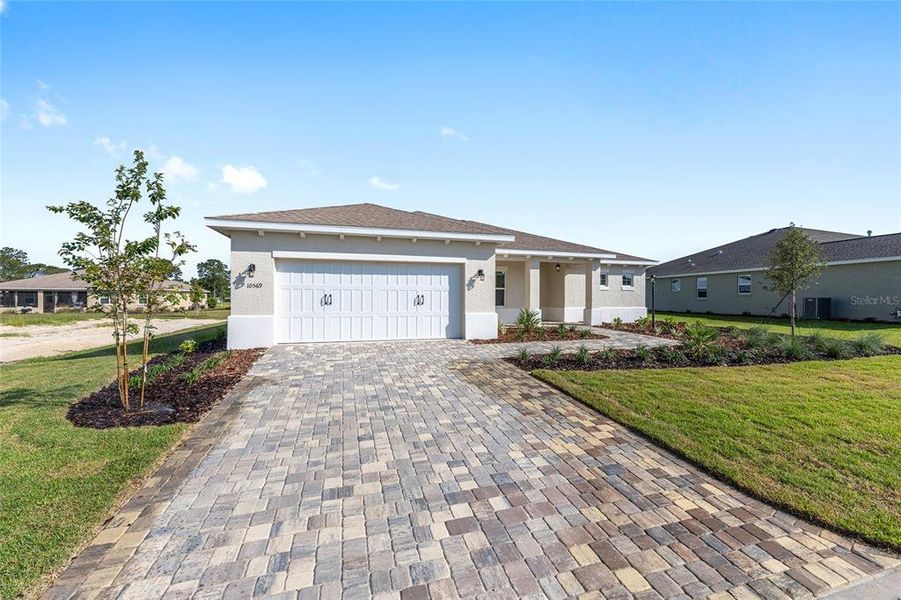 Front exterior of a new home in On Top of the World Communities, Ocala, FL, highlighting curb appeal (Image 18).