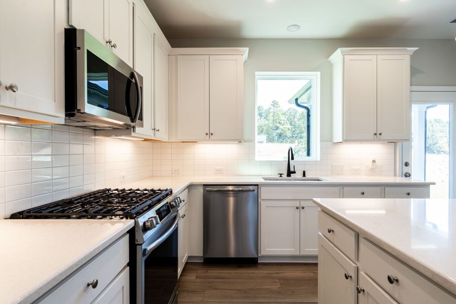 Representative furnished interior of a home built from the The Crossman by David Weekley Homes in Serenity - The Cottage Collection, Fuquay Varina (Image 6).