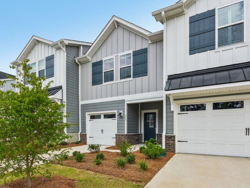 Front exterior of a new home in Meadows at Wilson Farms - The Summit Series, Fort Mill, SC, highlighting curb appeal (Image 1). Front exterior of a new home in Meadows at Wilson Farms - The Summit Series, Fort Mill, SC, highlighting curb appeal (Image 1).