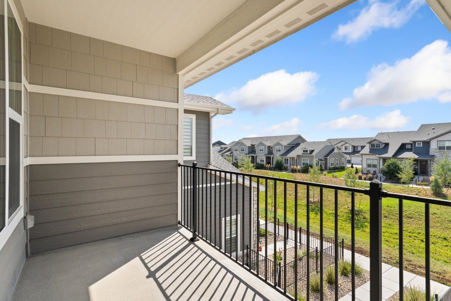 Exterior details and patio area of a home in The Lakes at Centerra, Loveland (Image 3).
