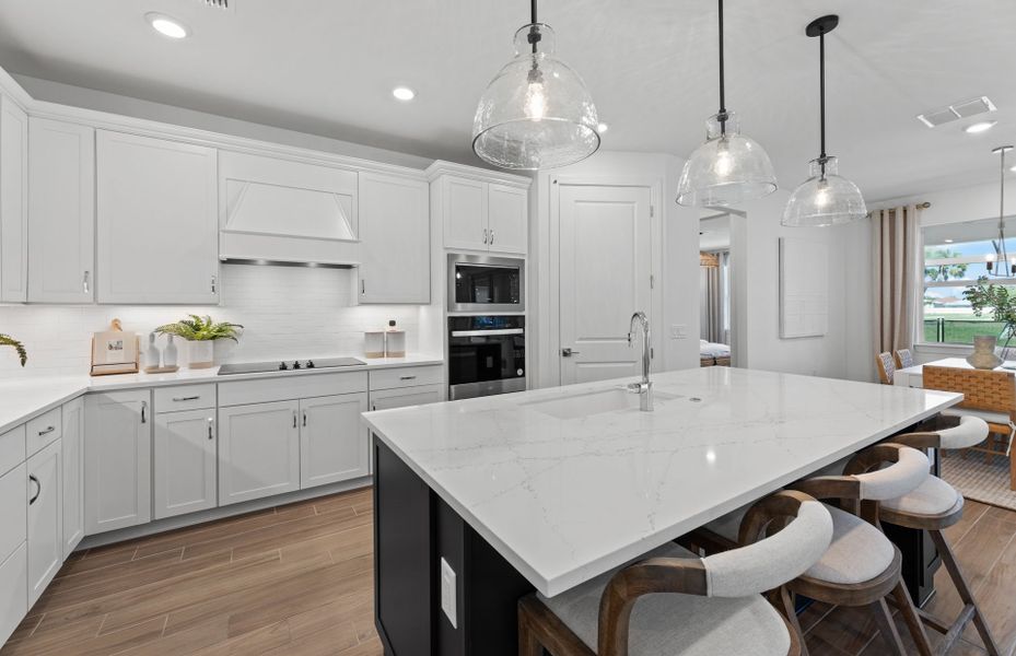 Kitchen with decorative back-splash and large center island